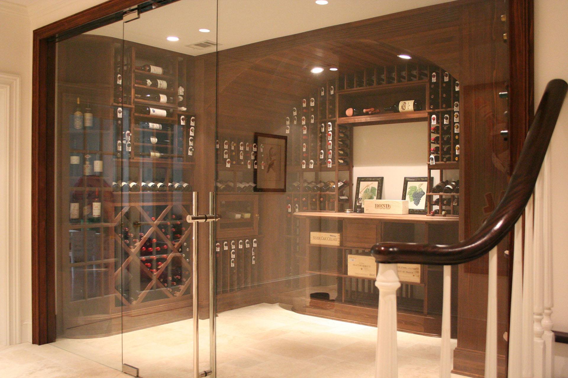Glass window and door enclosing a wine cellar
