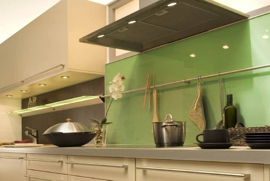 Lime green backsplash above the stove area in a kitchen