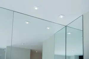 Mirrors lining the wall of a room