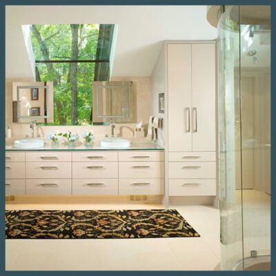 Bathroom with rounded glass shower doors, glass countertops, mirrors and a large window