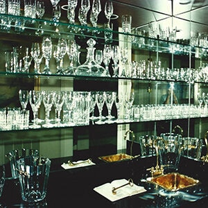 Floating glass shelves holding glassware