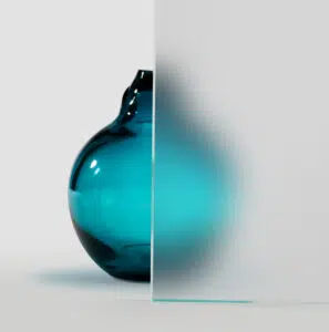 Aqua colored jar behind Low-Iron Satin Etch glass