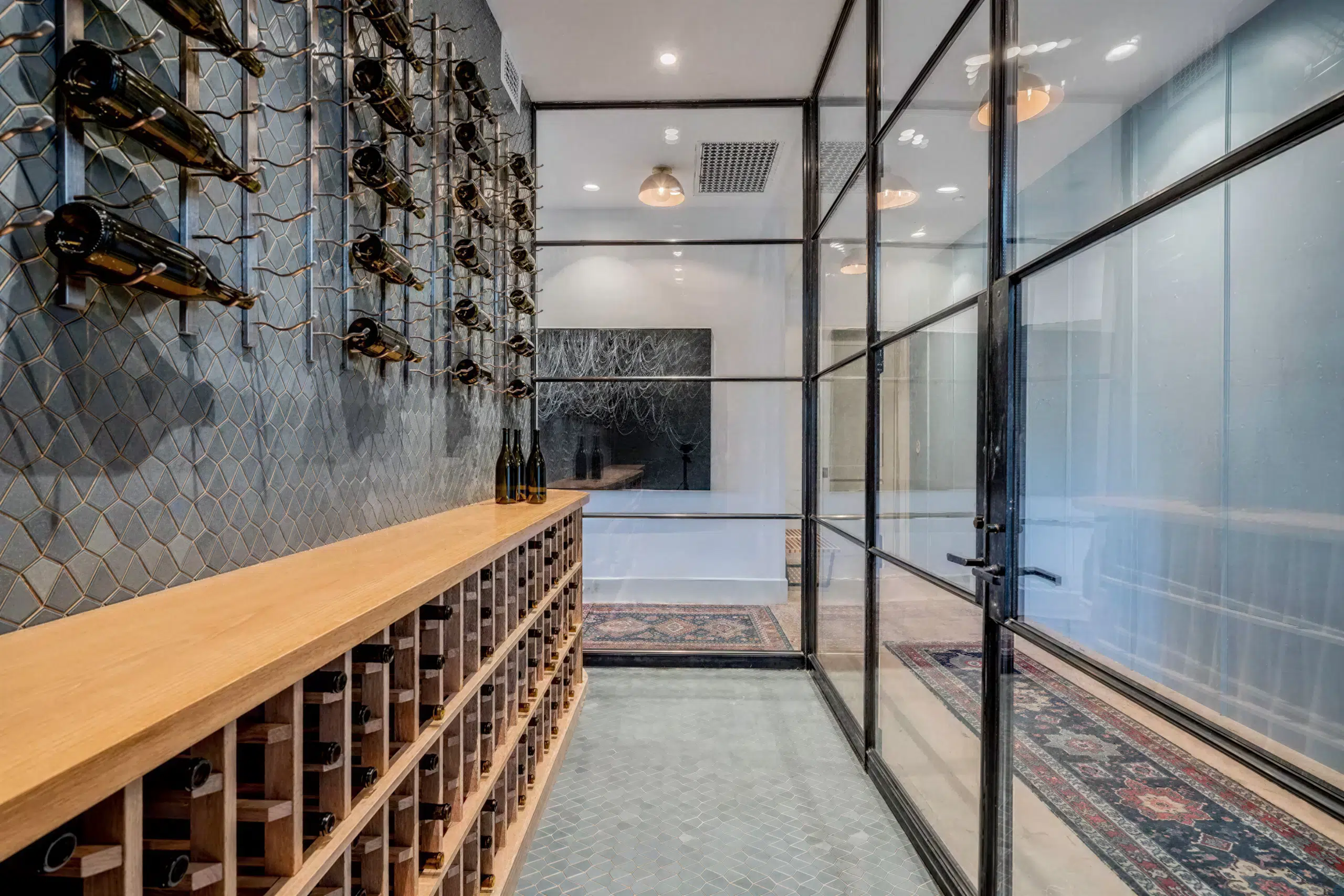 wine cellar with high-end framed glass walls and door